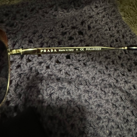 Prada Women\'s Sunglasses - Gold Frame with Black Lenses red trim